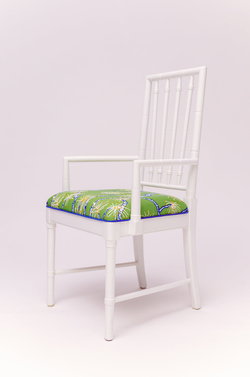 Classic faux-bamboo styling meets a splash of poolside personality. With its crisp refurbished antique in high gloss white frame. Upholstery fabric is by Ferrick Mason in Calliandra, this armchair is ready to bring a sunny, tropical breeze straight into your favorite corner. Set includes 6 armless chairs and two arm head chairs.