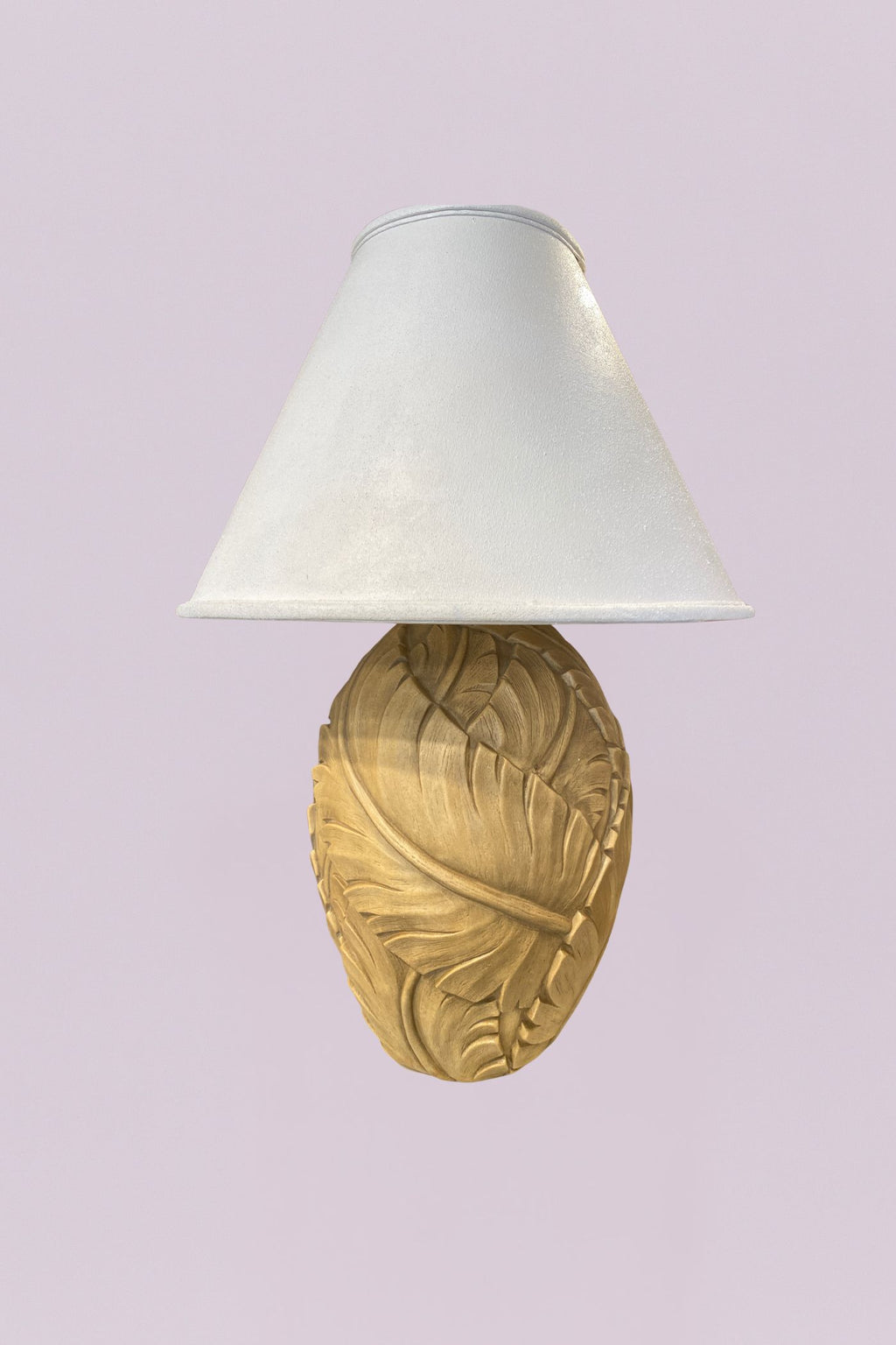 Bring a touch of the tropics indoors with this charming pair of table lamps. Each base features a beautifully textured, oversized leaf design that wraps around an ovoid form, finished in a soft, sun-washed cream that highlights every vein and fold.