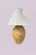 Bring a touch of the tropics indoors with this charming pair of table lamps. Each base features a beautifully textured, oversized leaf design that wraps around an ovoid form, finished in a soft, sun-washed cream that highlights every vein and fold.
