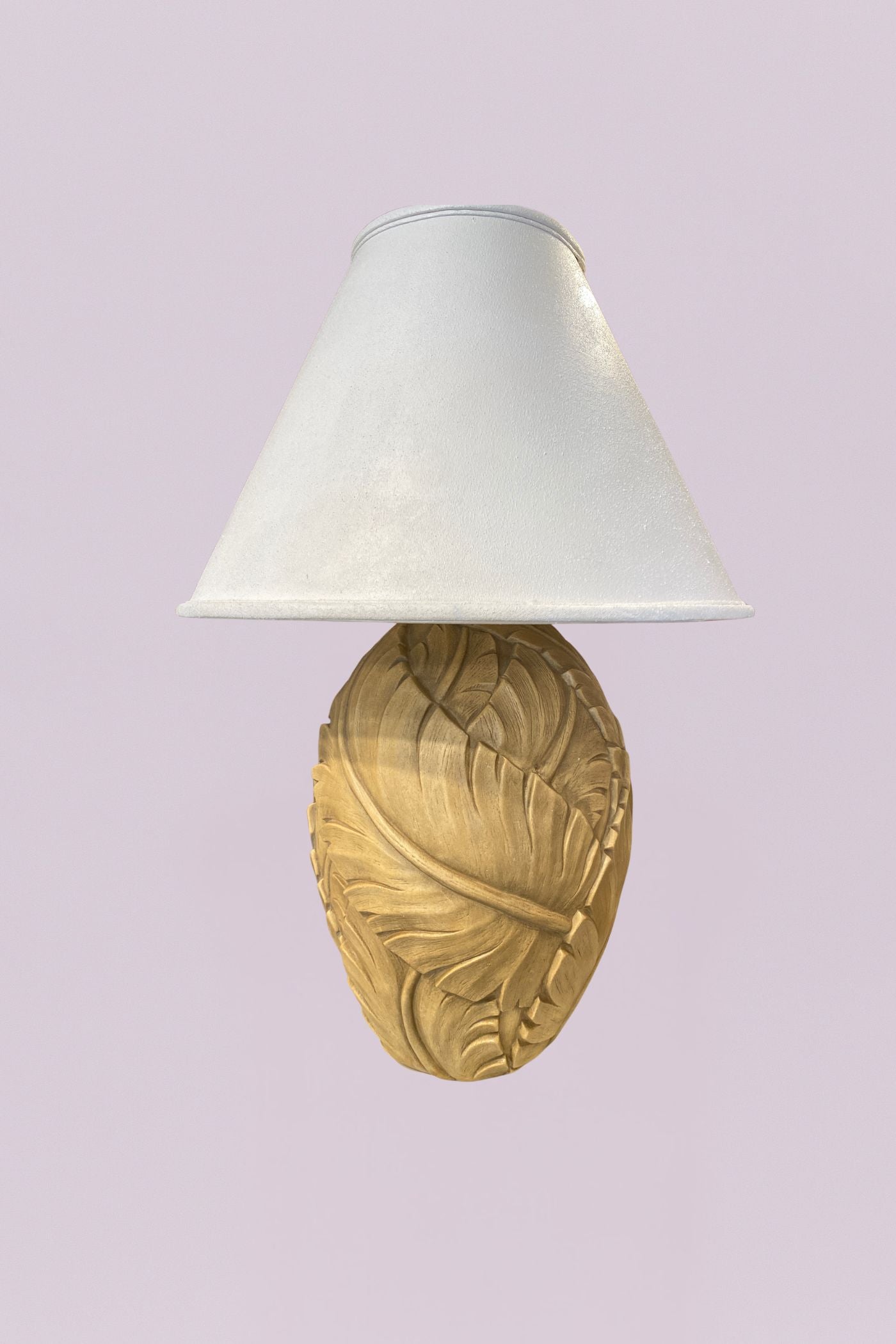 Bring a touch of the tropics indoors with this charming pair of table lamps. Each base features a beautifully textured, oversized leaf design that wraps around an ovoid form, finished in a soft, sun-washed cream that highlights every vein and fold.