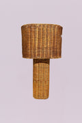 This hand-woven rattan statement piece features a delightfully chunky cylindrical base and an oversized drum shade for a look that's equal parts rustic and eccentric. It casts a warm, textured glow perfect for illuminating your unique style and sparking "where did you find that?" conversations.