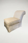 Elevate your living space with this sophisticated Cabana Slipper Chair, featuring a timeless tan and white vertical stripe pattern. This piece seamlessly blends an elegant, regal aesthetic with a cozy and inviting feel, making it a versatile addition to high-end interiors.