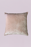 Wrapped in high-luster crushed velvet, this 24x24 accent piece offers a multidimensional glow that shifts from soft blush to warm champagne. Its generous scale and flanged edges provide a structured, designer look while the plush texture invites you to sink in. Perfect for adding a touch of sophisticated romance to a neutral bedding set or a velvet sofa.