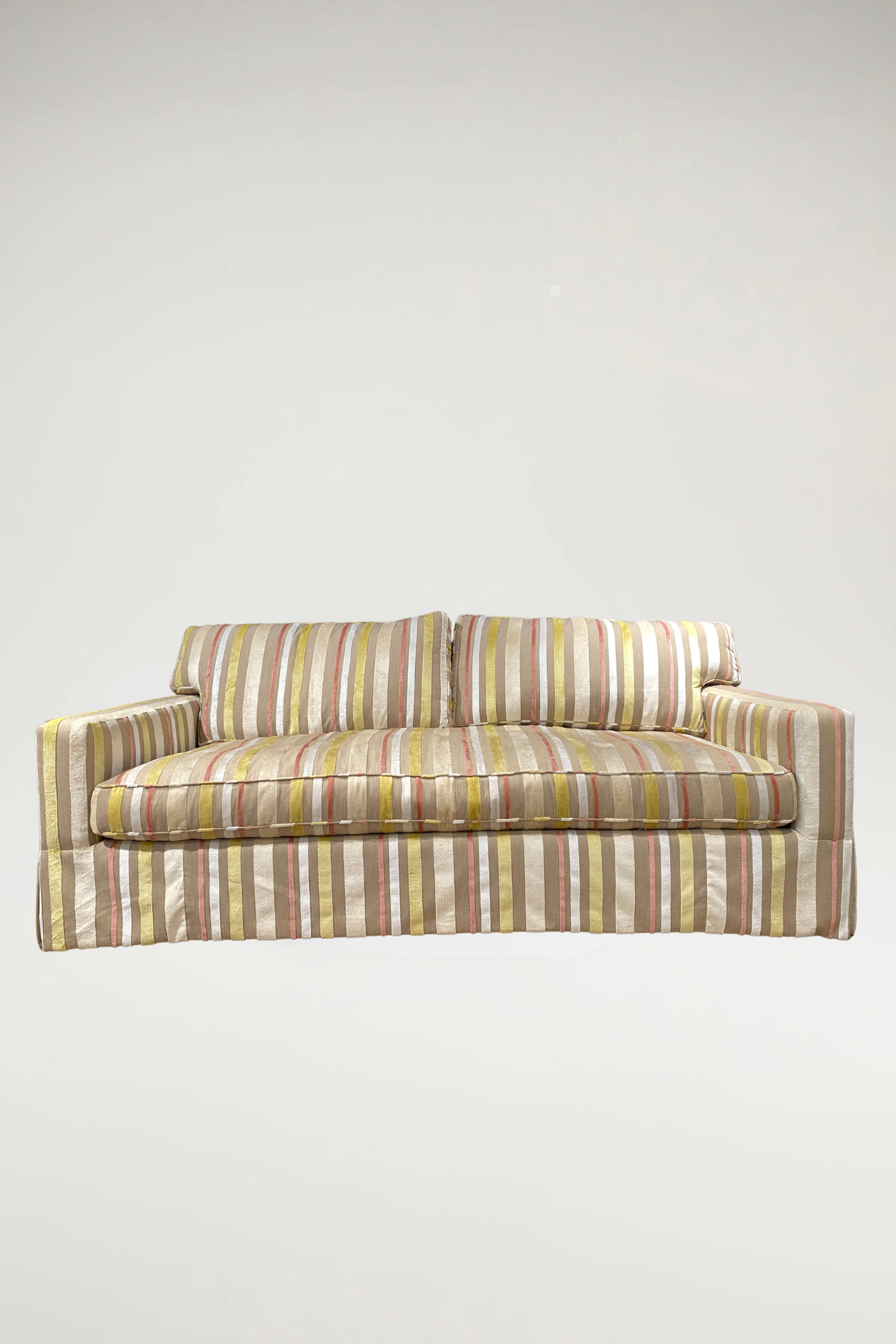 Add a vibrant, sophisticated touch to your space with this designer piece featuring a shimmering stripe pattern in coral, off-white, yellow, and natural linen. The tailored silhouette includes a single-bench seat and a classic dressmaker skirt, offering an elegant yet inviting aesthetic.