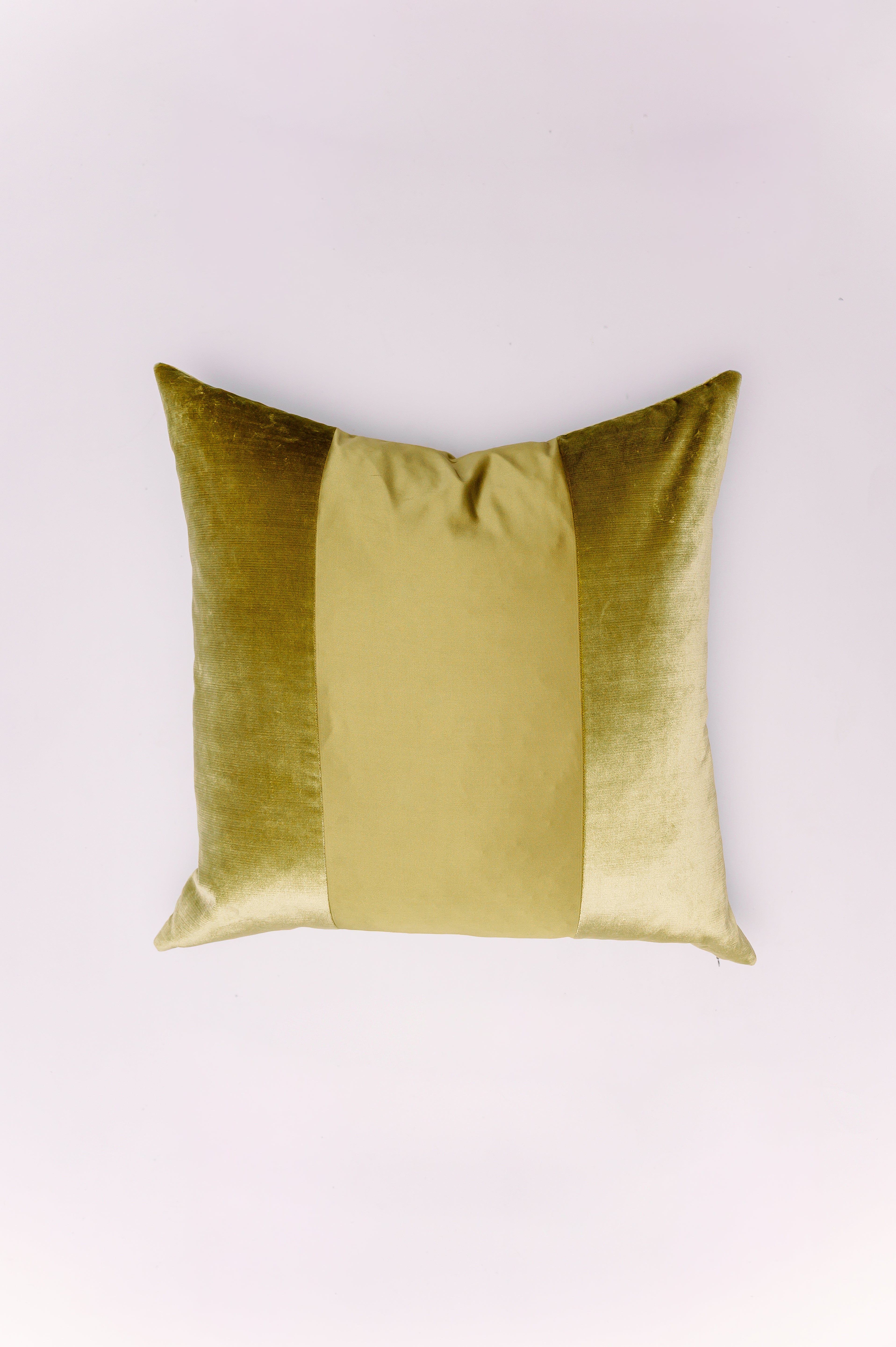 Indulge in the opulent texture of our chartreuse velvet pillow. This stunning piece features a decadent, crushed velvet in a rich, olive-gold hue on the sides, perfectly framing a center panel of smooth, complementary satin or silk. The combination of textures adds a sophisticated depth, making it an exquisite accent for any sofa, armchair, or bed. Its vibrant, jewel-tone color brings a touch of classic luxury and warmth to your home décor. Perfect for a space that demands drama and elegance.
