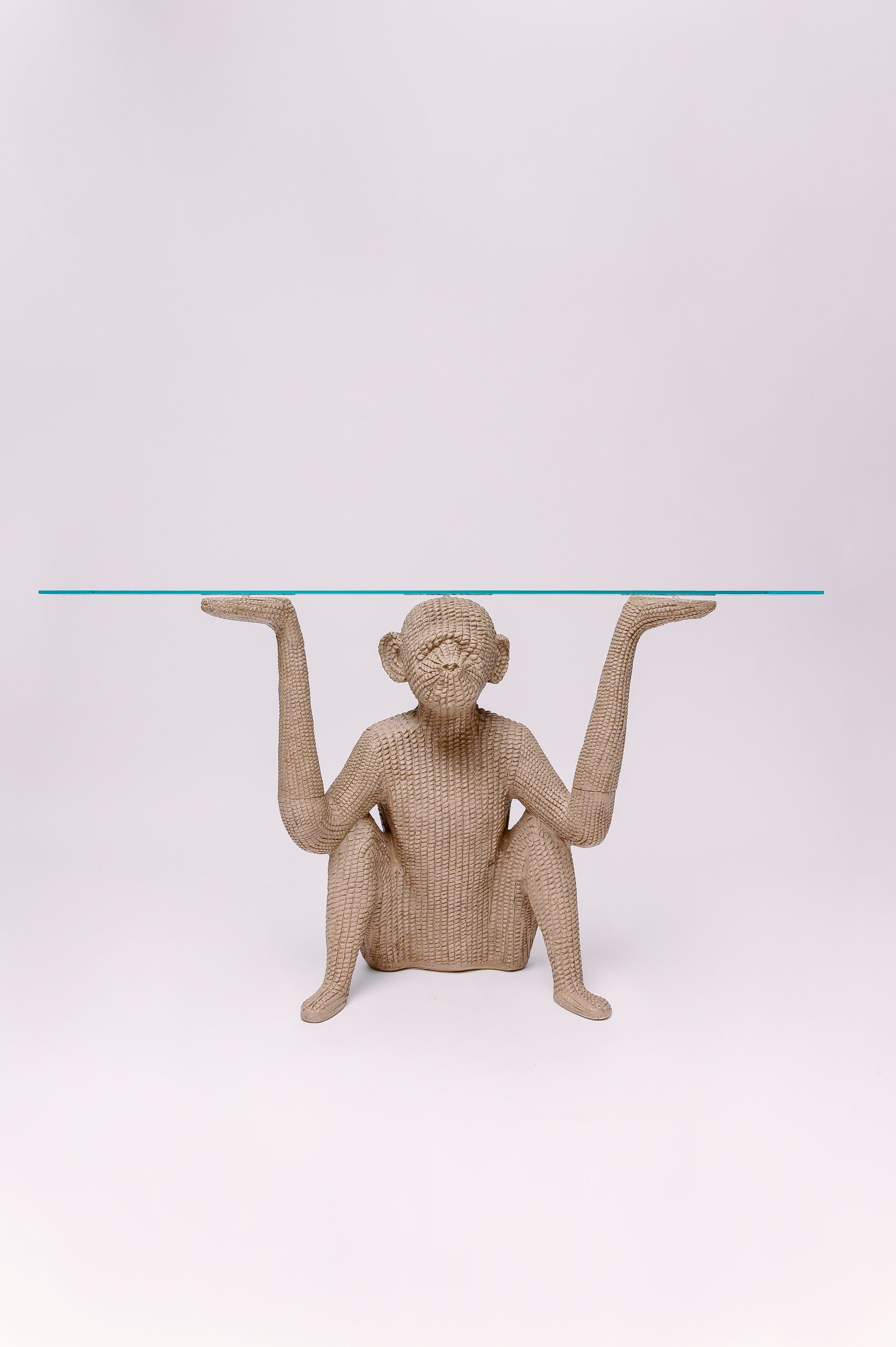 This vintage console table is made of resin to resemble woven wicker/reed,  inspired by the designs of Mario Lopez Torres. The table is 3 pieces, the arms separate from the body for ease of moving.