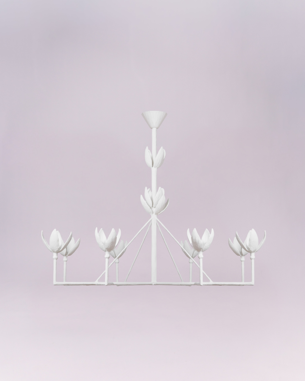 Crafted entirely in matte white, the light cups are sculpted to resemble opening lotus or tulip blossoms, lending the piece a distinct botanical and organic aesthetic. Its simple color palette and symmetrical framework make it a versatile, elegant statement piece suitable for contemporary, minimalist, or feminine interiors.