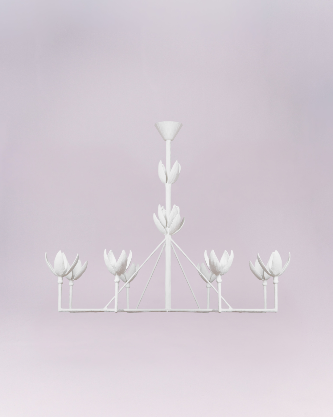 Crafted entirely in matte white, the light cups are sculpted to resemble opening lotus or tulip blossoms, lending the piece a distinct botanical and organic aesthetic. Its simple color palette and symmetrical framework make it a versatile, elegant statement piece suitable for contemporary, minimalist, or feminine interiors.